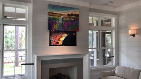 how to hide a TV behind a painting - exploring the art of concealing electronics in home decor